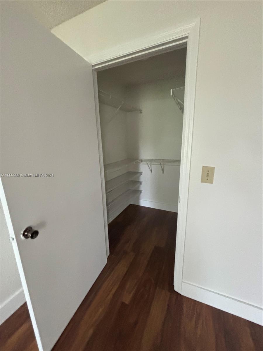 an empty room with wooden floor