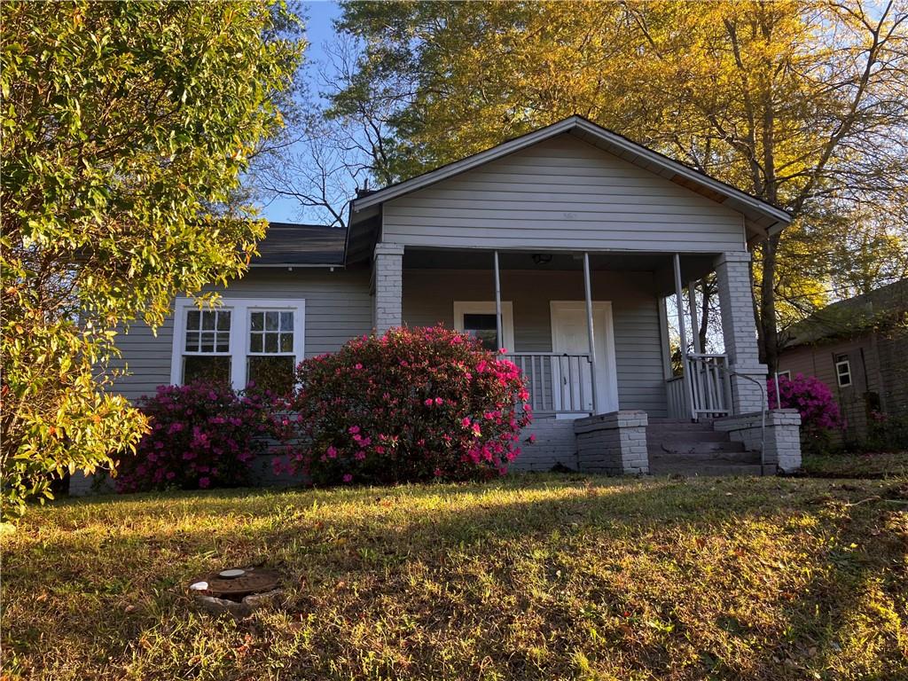 a front view of a house with garden