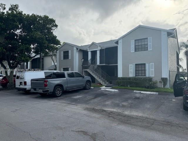 a view of a car parked in front of a house