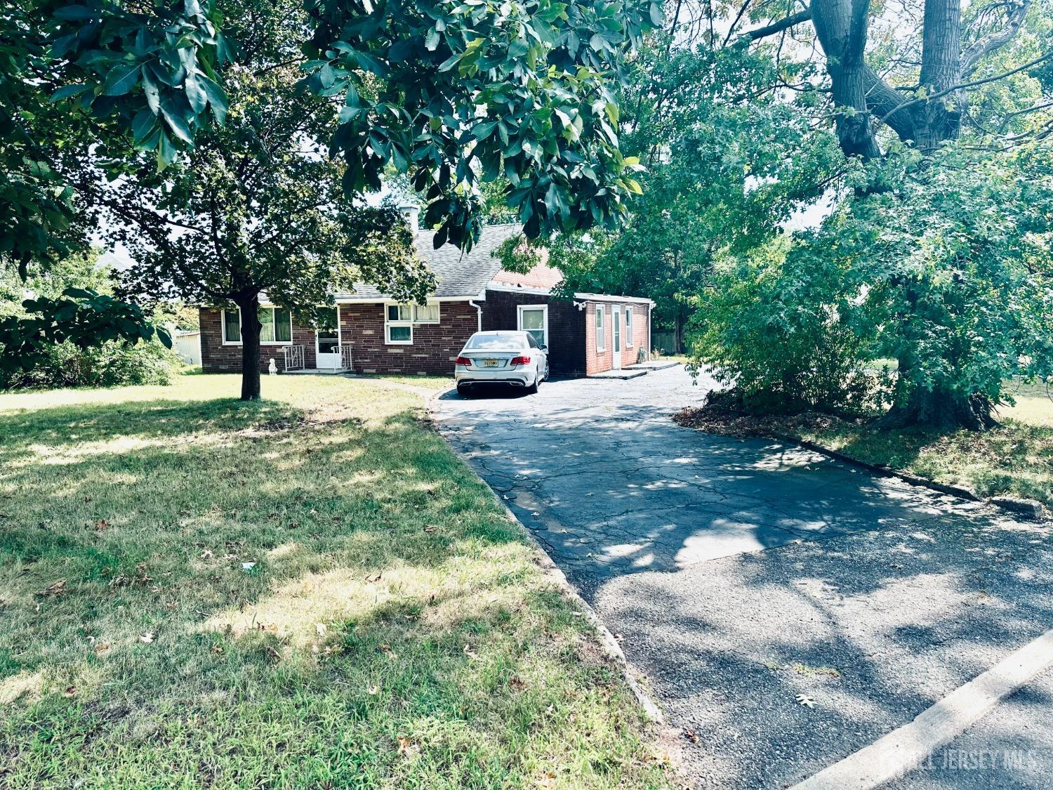 a house with trees in the background