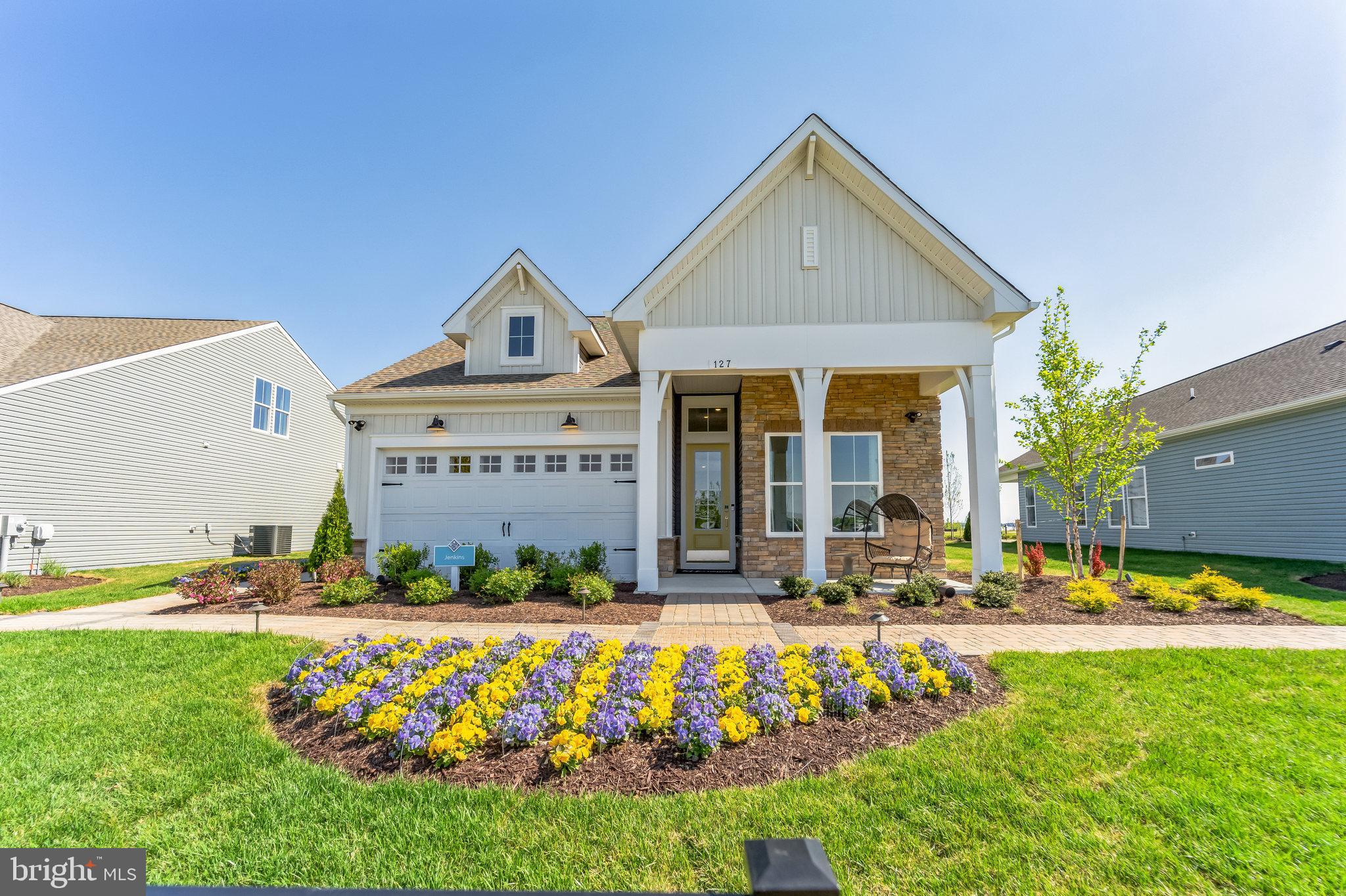 a front view of the house with outdoor space