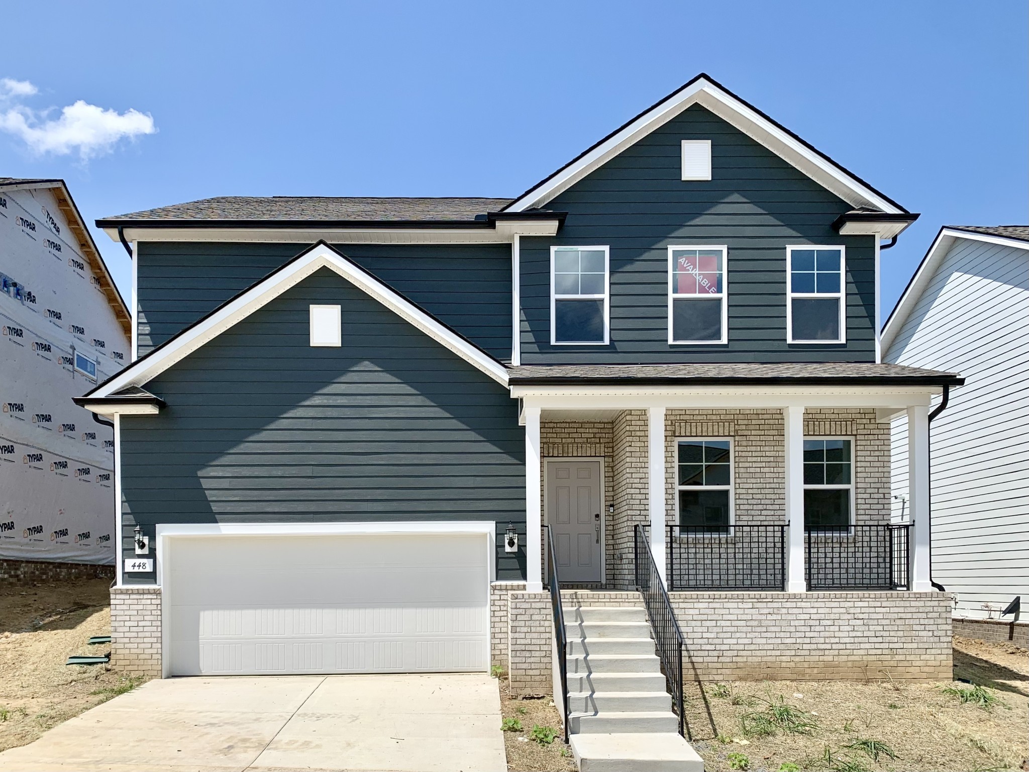 a front view of a house with a garage