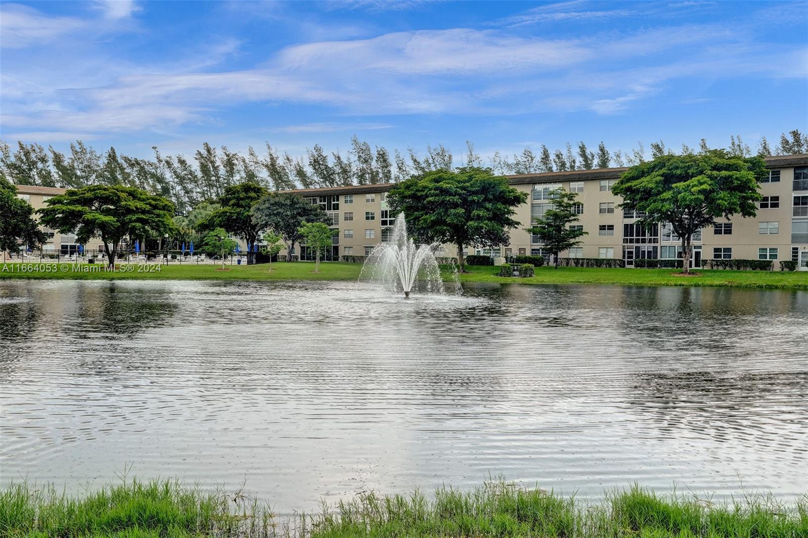 a view of a lake with houses in the back