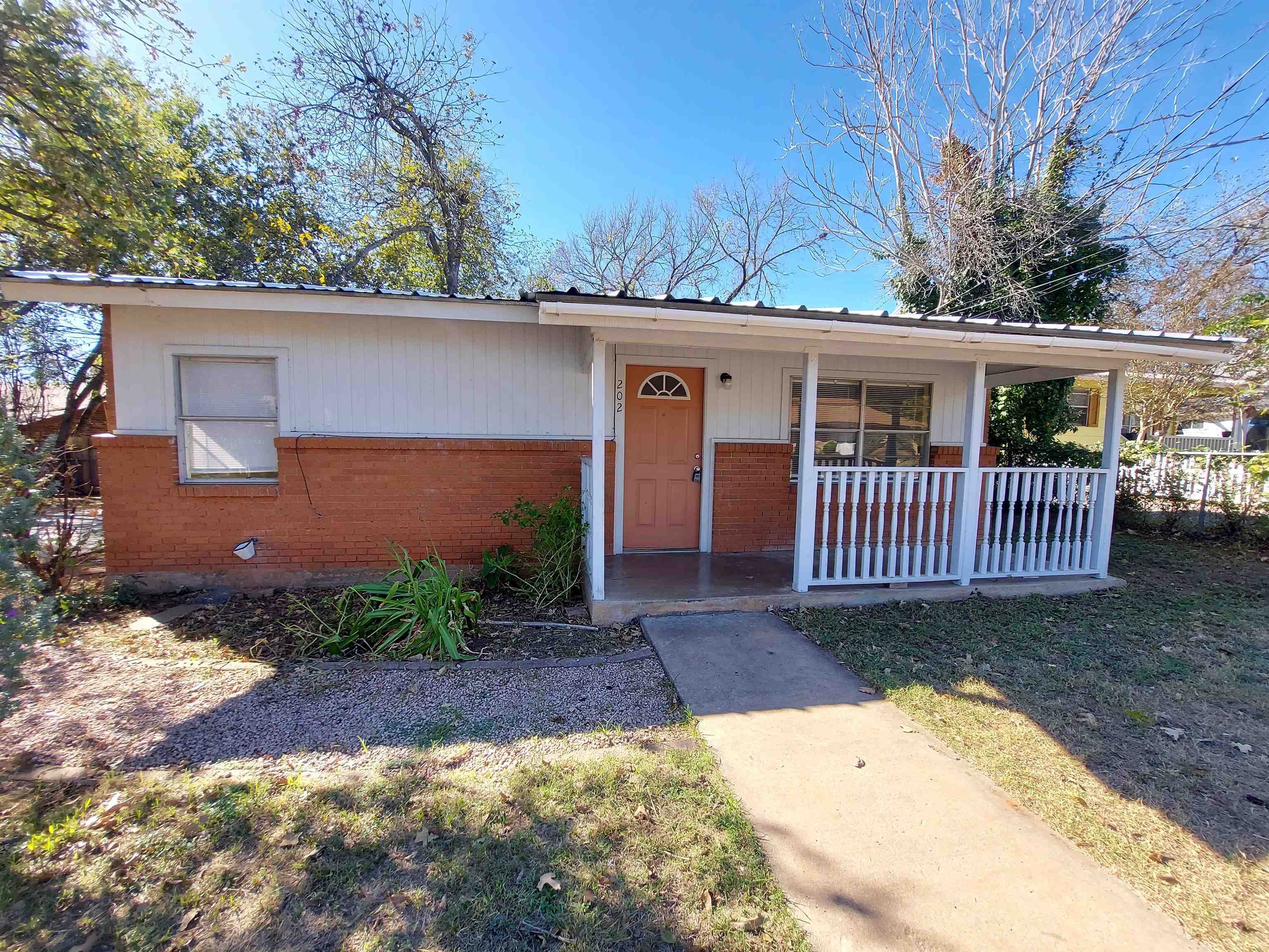 front view of a house with a yard