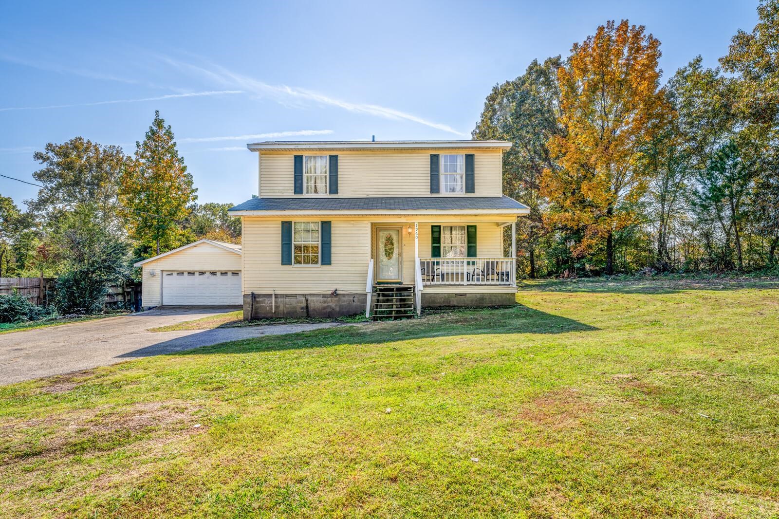 a view of a house with swimming pool and porch