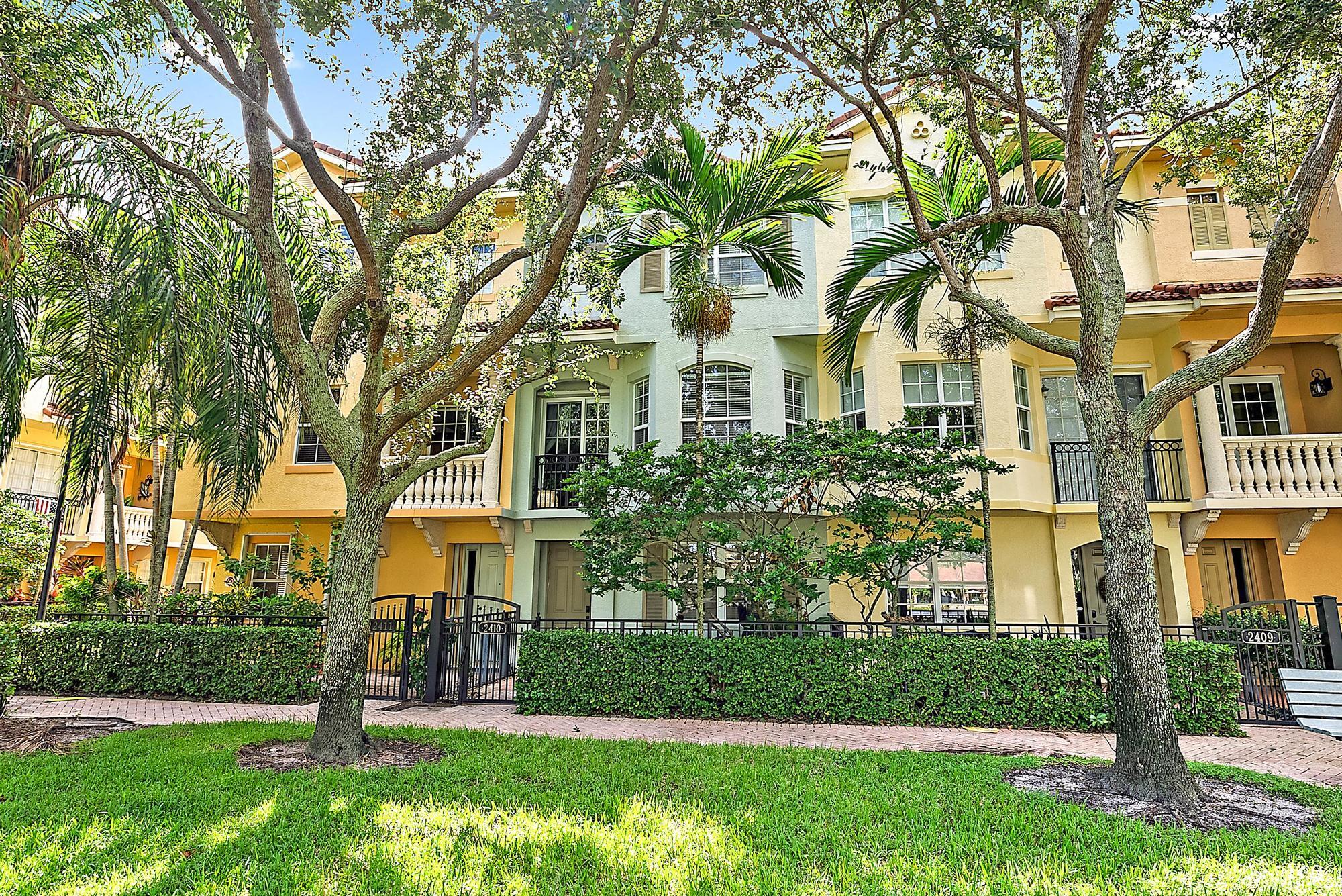 front view of a house with a tree in a yard