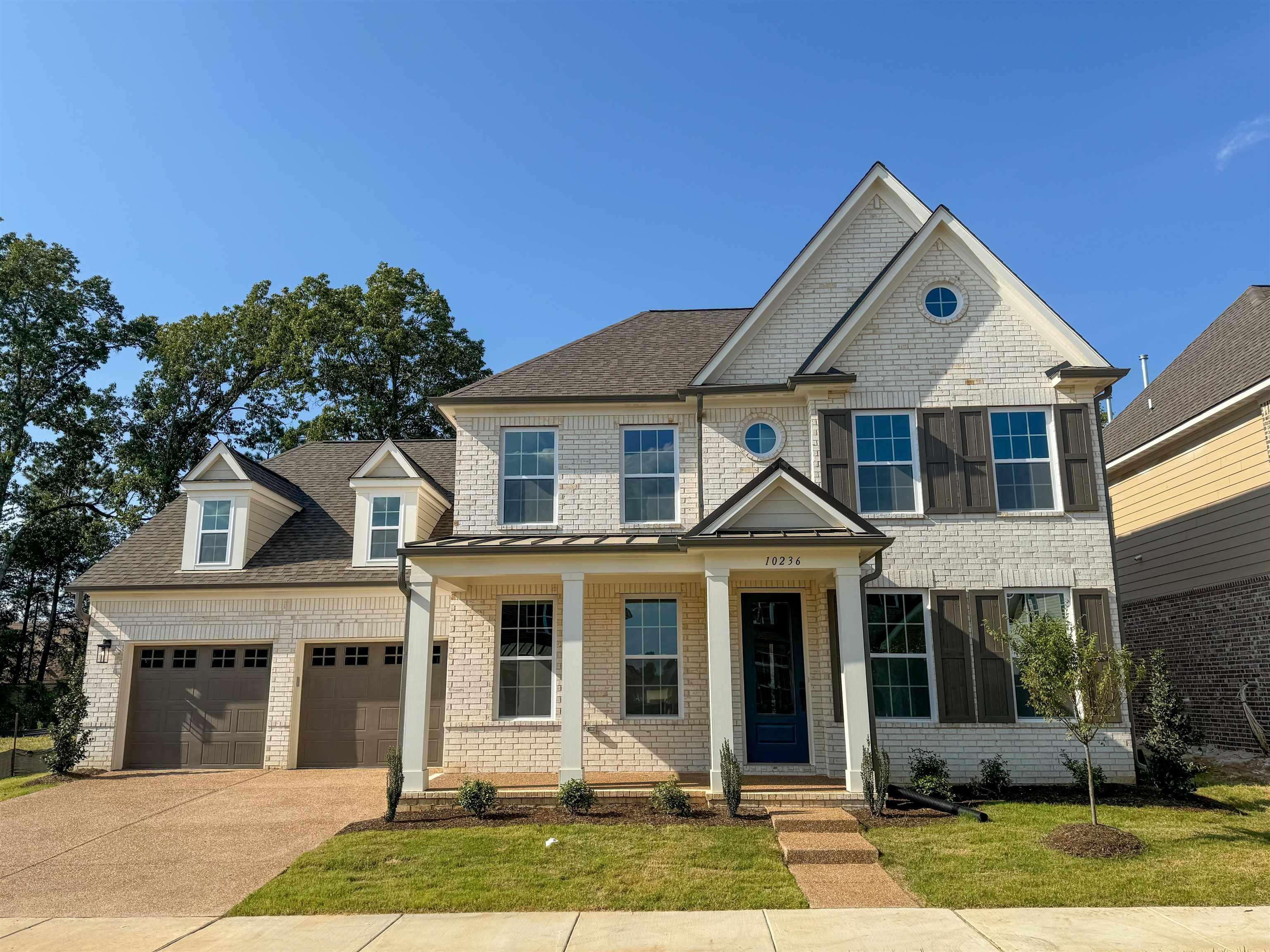 a front view of a house with a yard