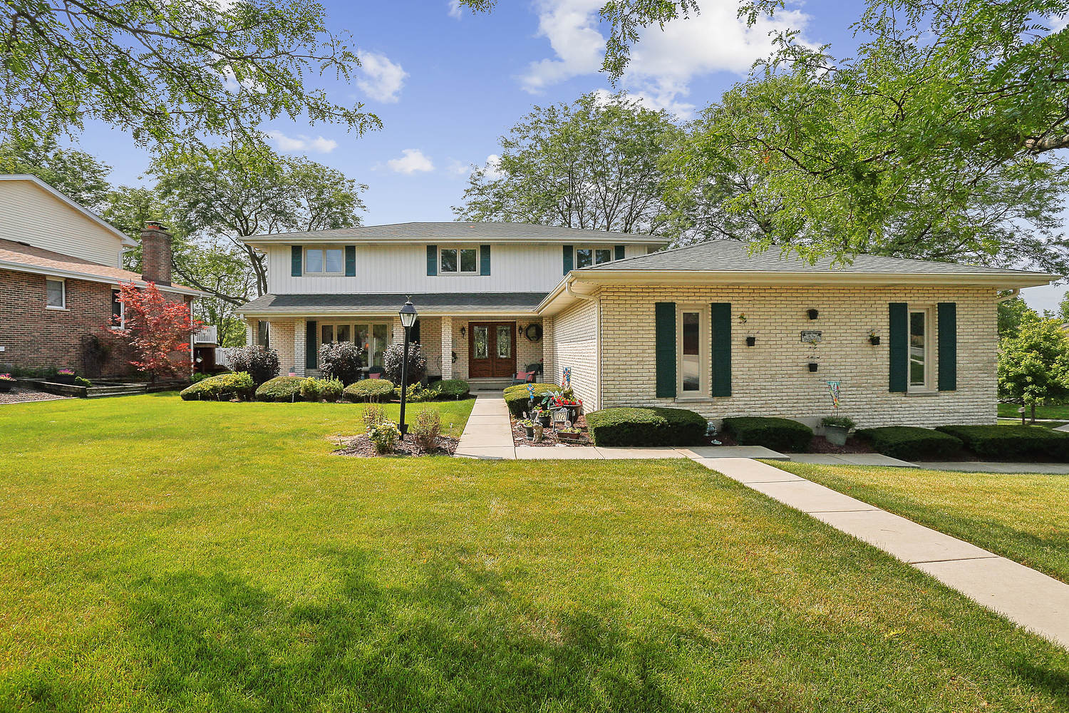 a view of a house with swimming pool and a yard