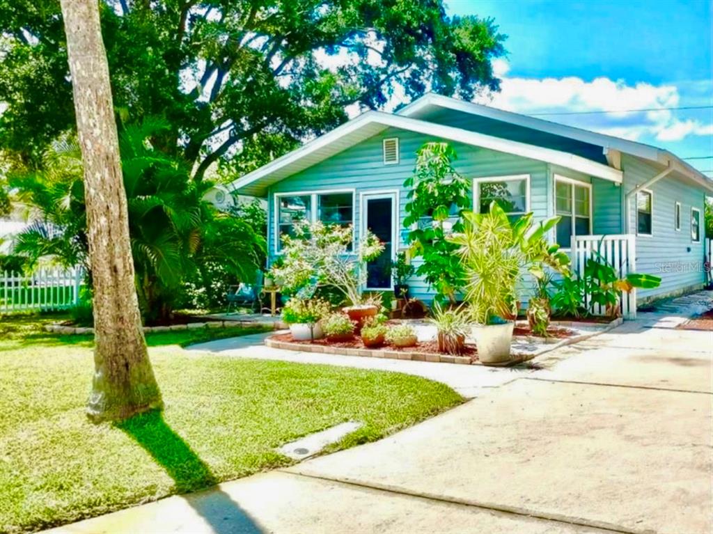 a front view of a house with garden