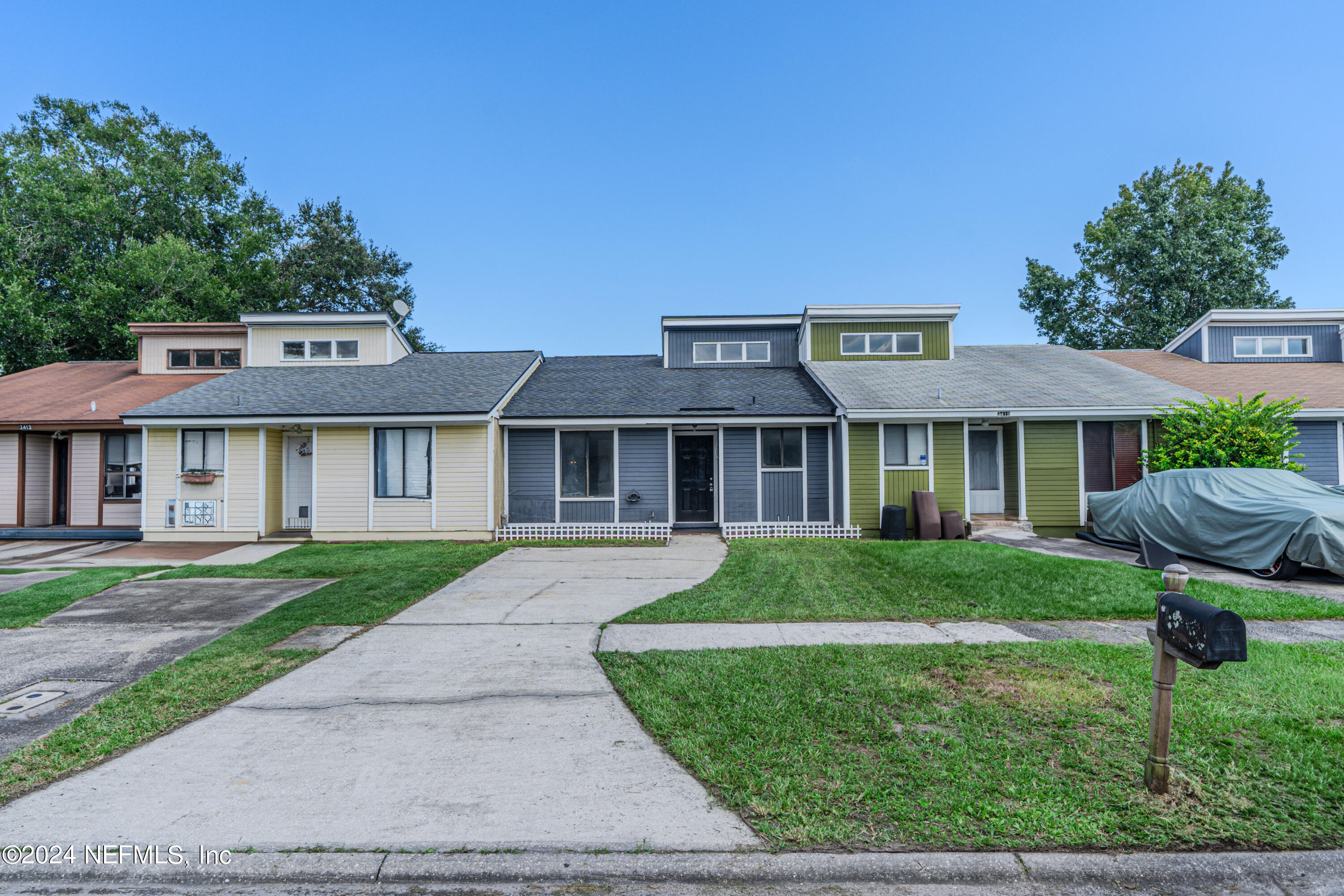 front view of a house with a yard