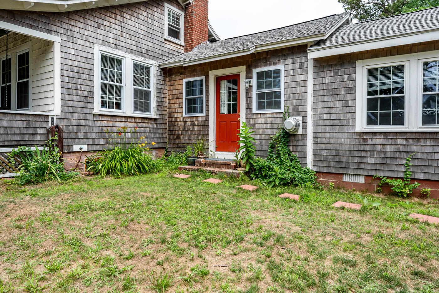 a front view of a house with garden