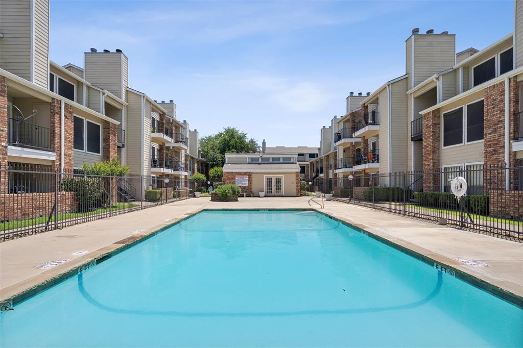 a swimming pool view with a outdoor seating