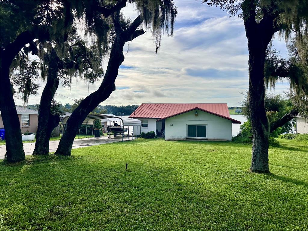 a view of a house with a yard