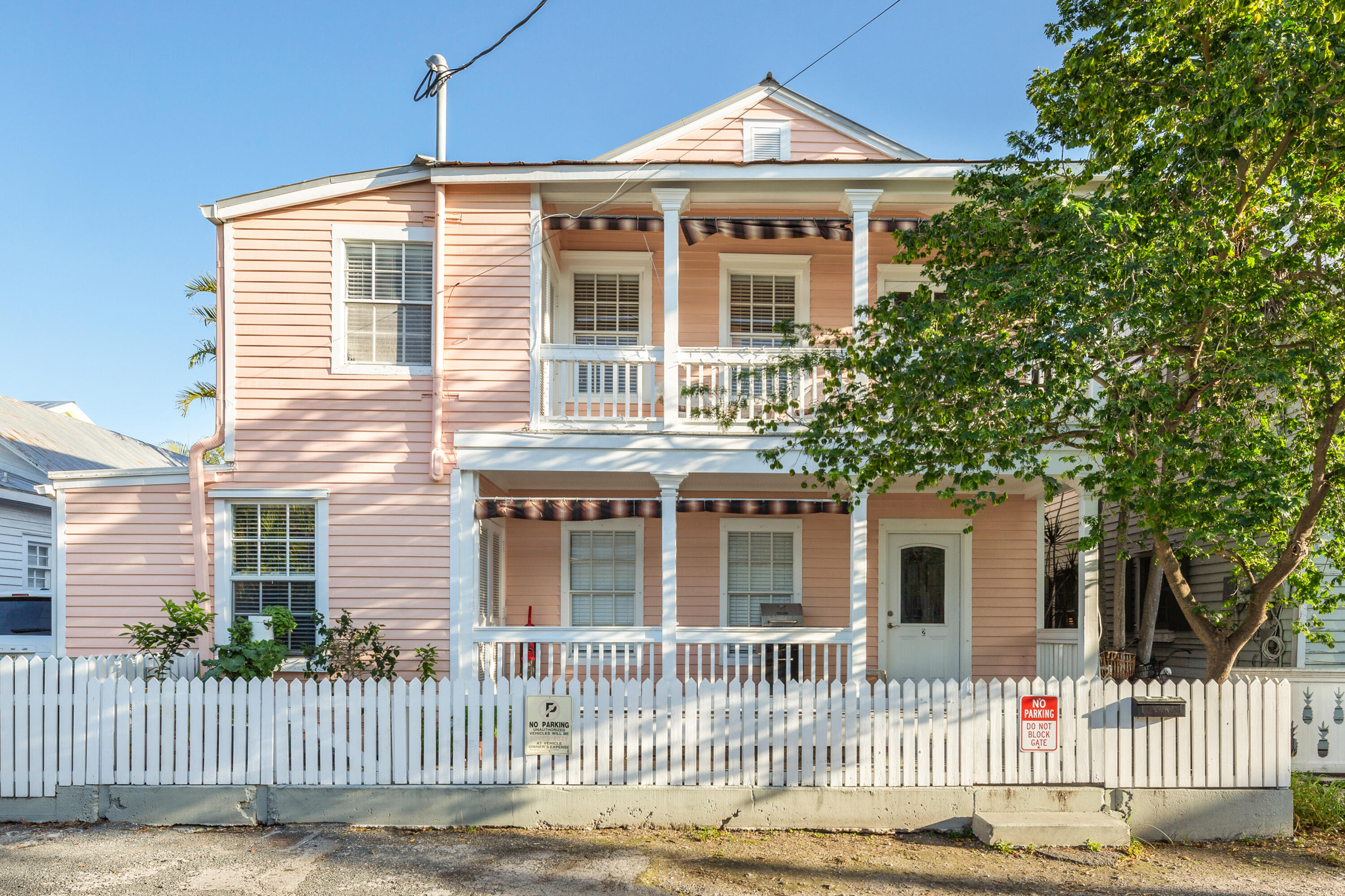 a front view of a house with a fence