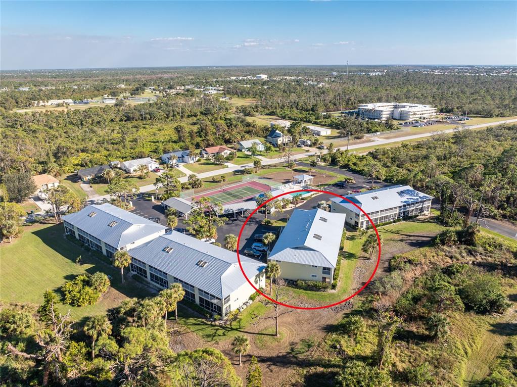 an aerial view of residential houses with outdoor space