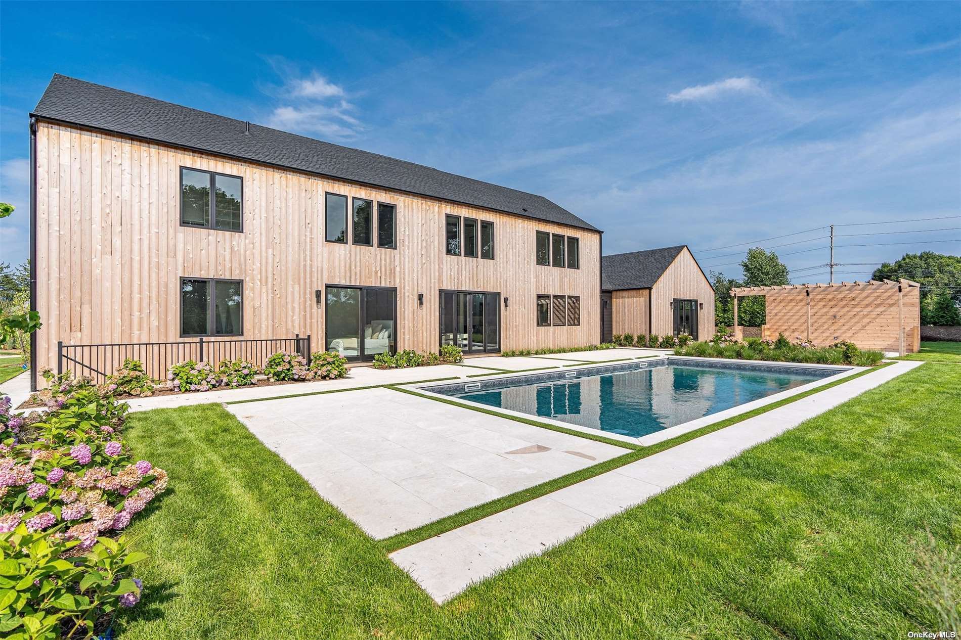 a view of house with swimming pool yard and outdoor seating