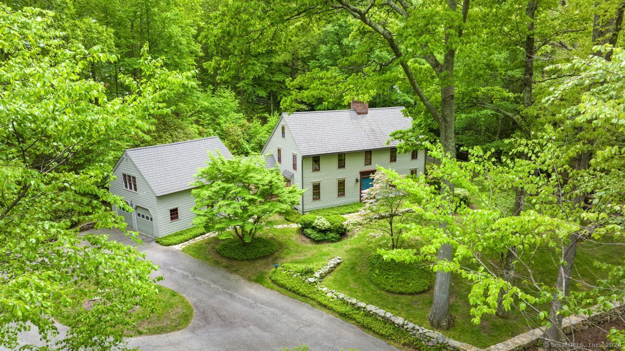 a aerial view of a house with a yard and plants