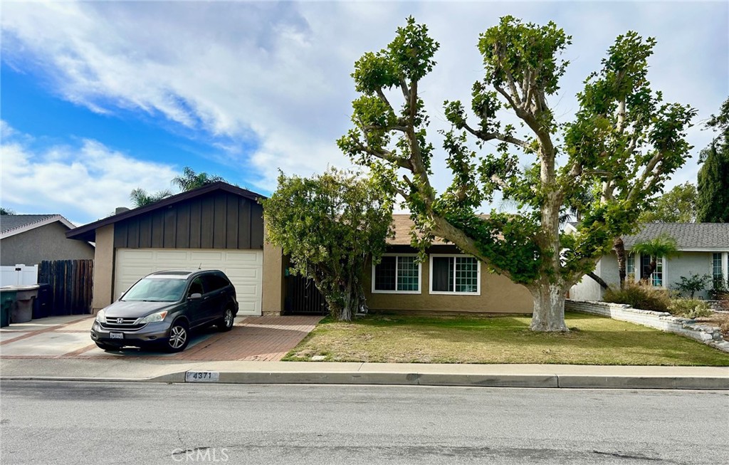 a car parked in front of a house