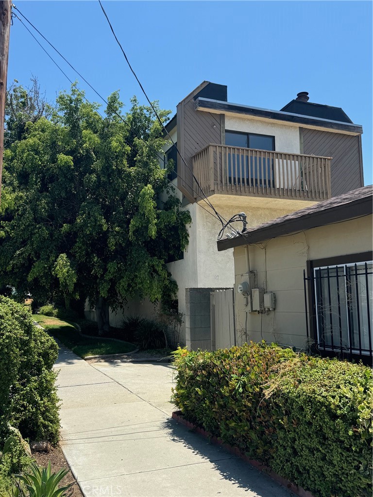 a view of a house with a flower garden