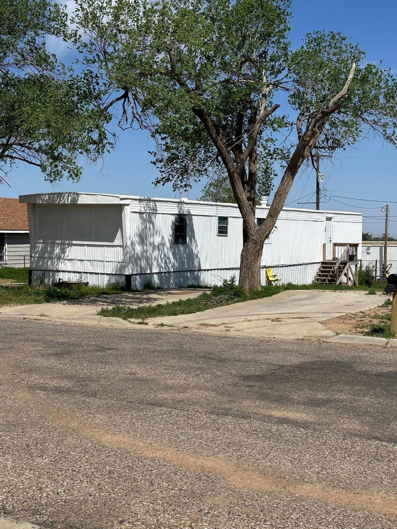 a view of building with car parked