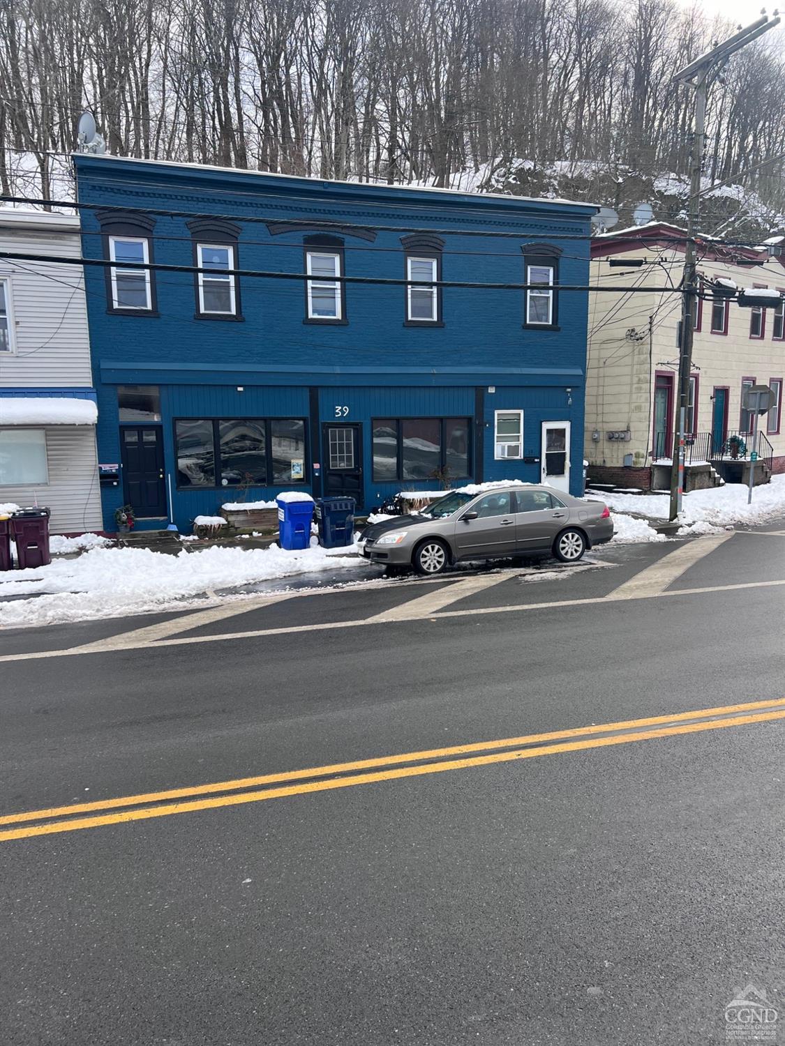 a view of street with parked cars