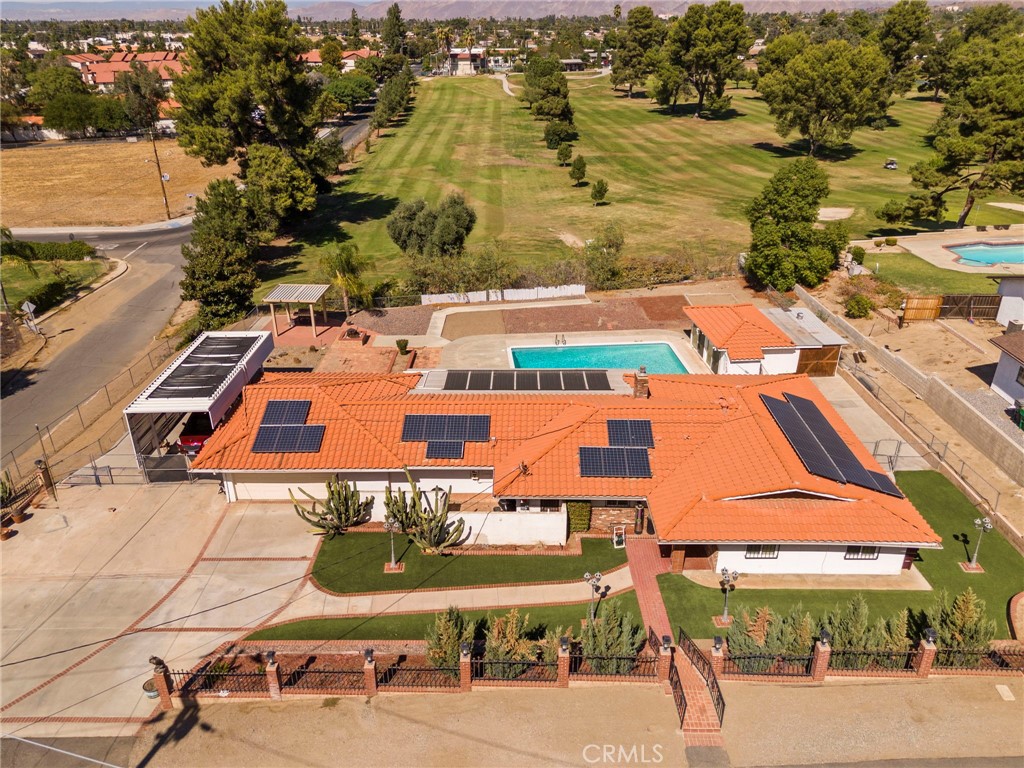 an aerial view of houses with yard