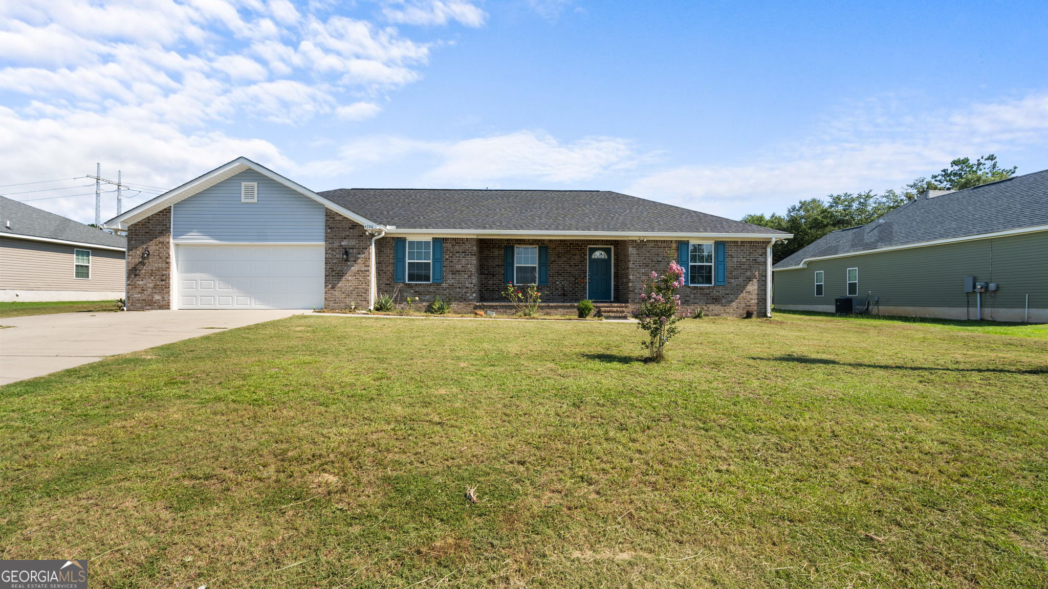 a house view with swimming pool and porch