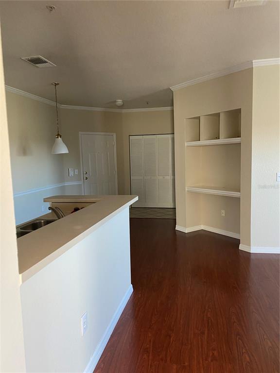 a room with wooden floor and closet