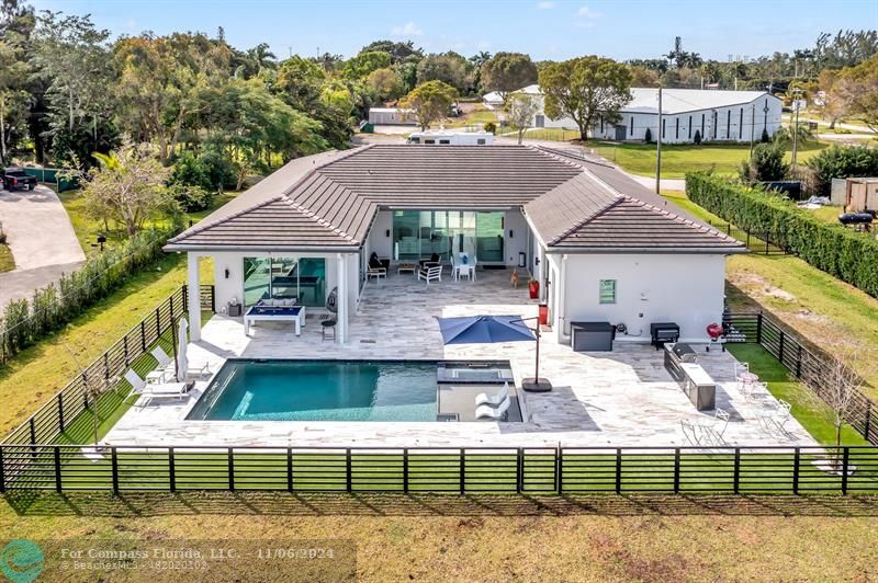 swimming pool view with a seating space