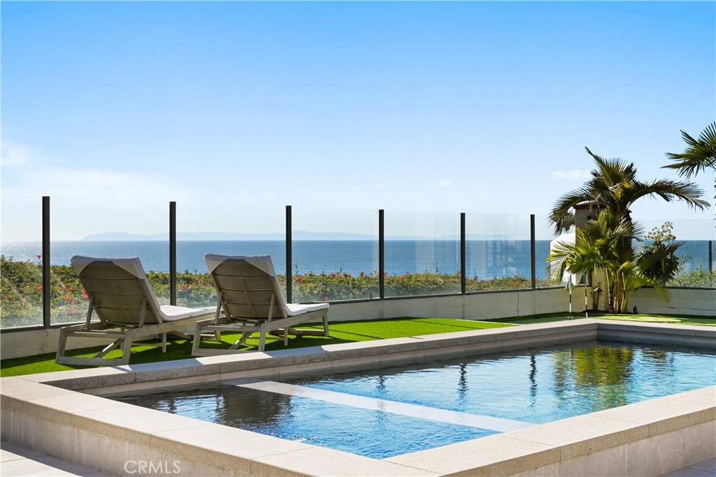 a view of swimming pool with outdoor seating