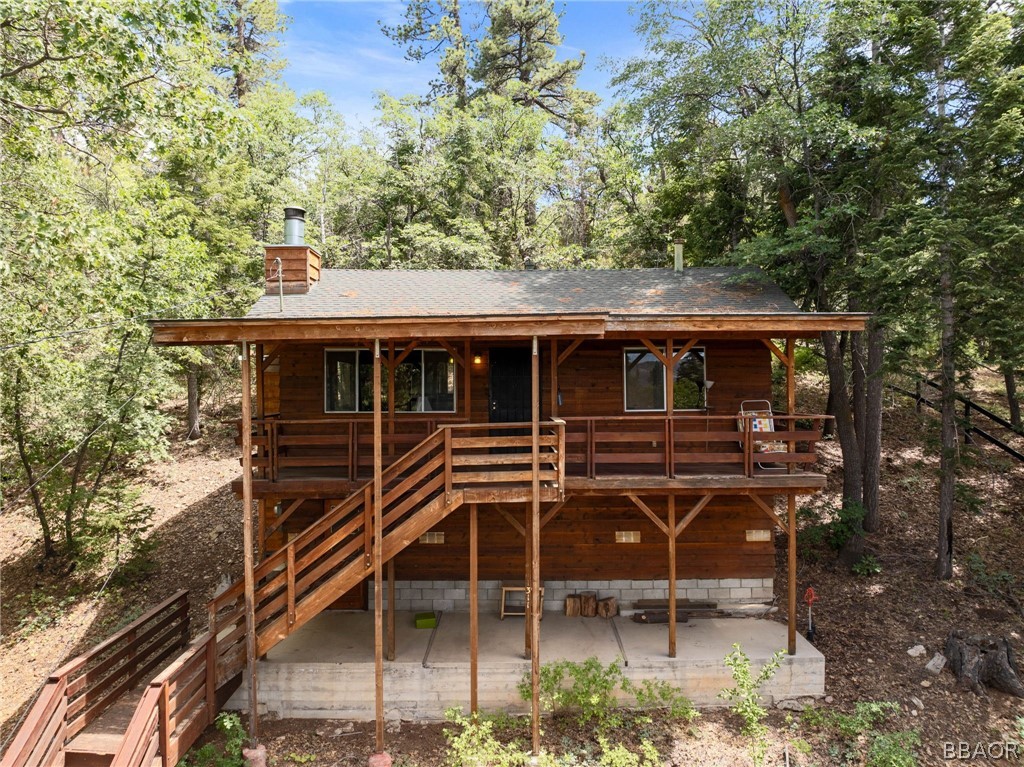 a view of house with backyard space and porch