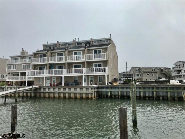 a view of a lake with building in front of it