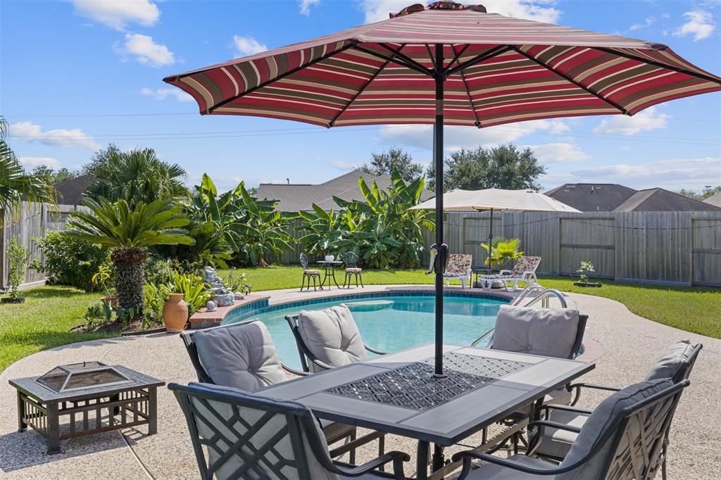 a view of yard with patio