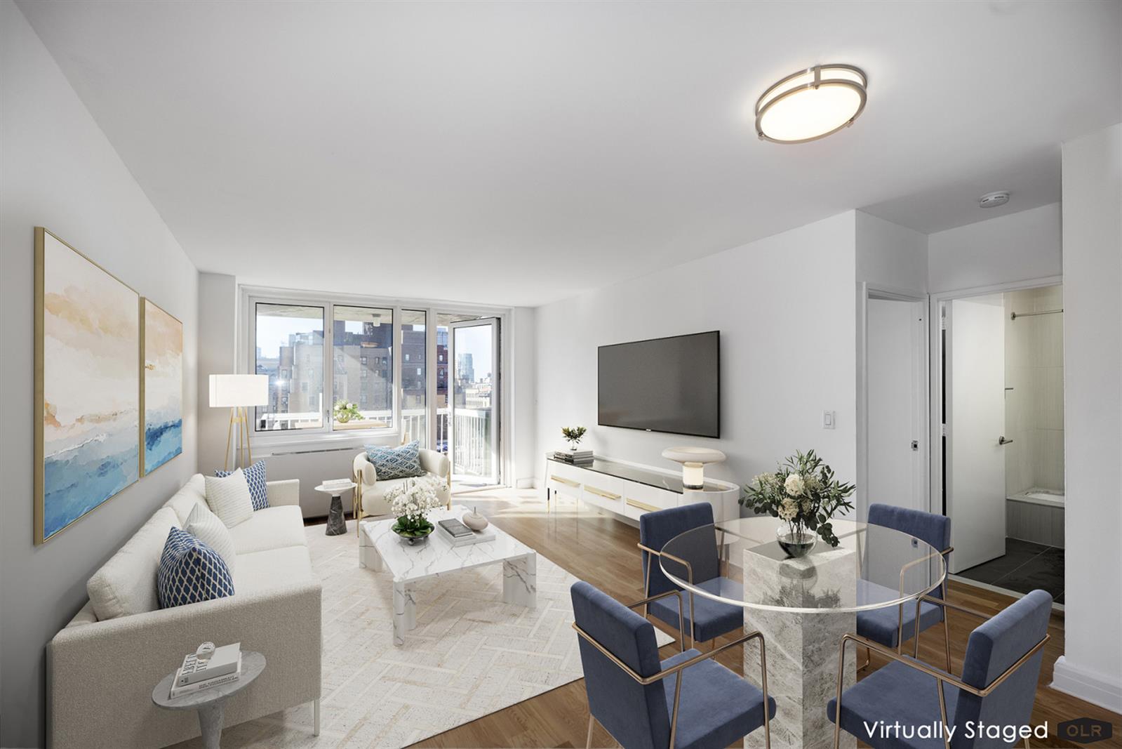 a living room with furniture wooden floor and a flat screen tv