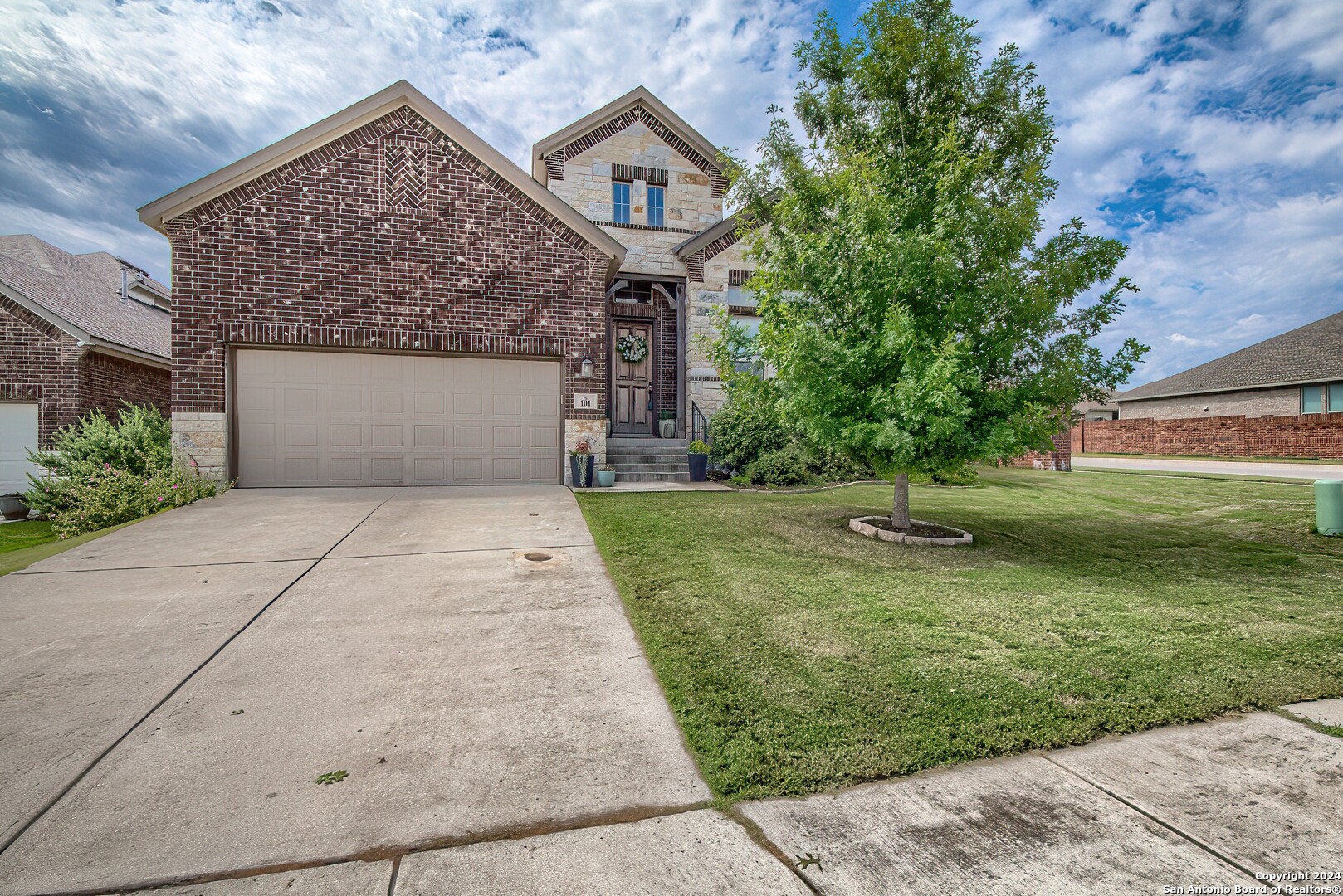 front view of a house with a yard