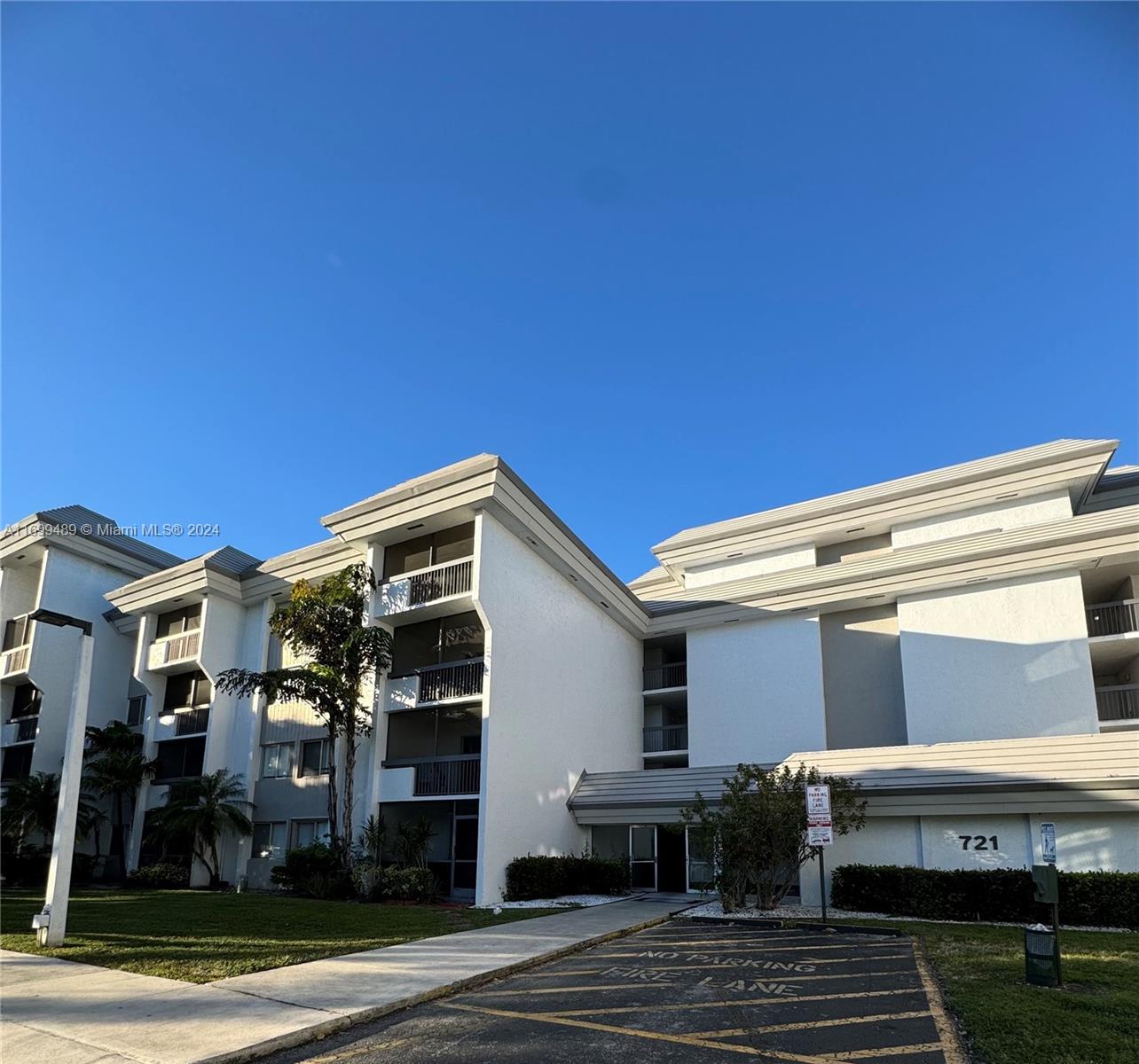 a front view of a building with garden