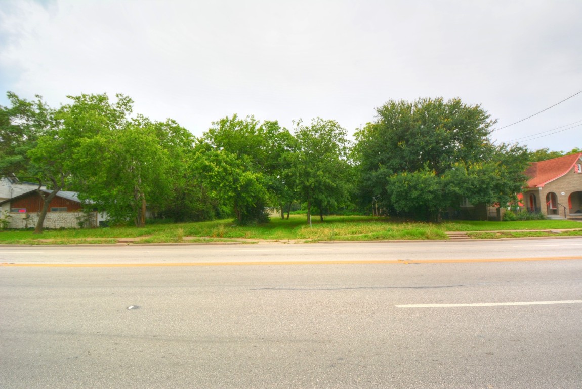 a view of a yard and a house