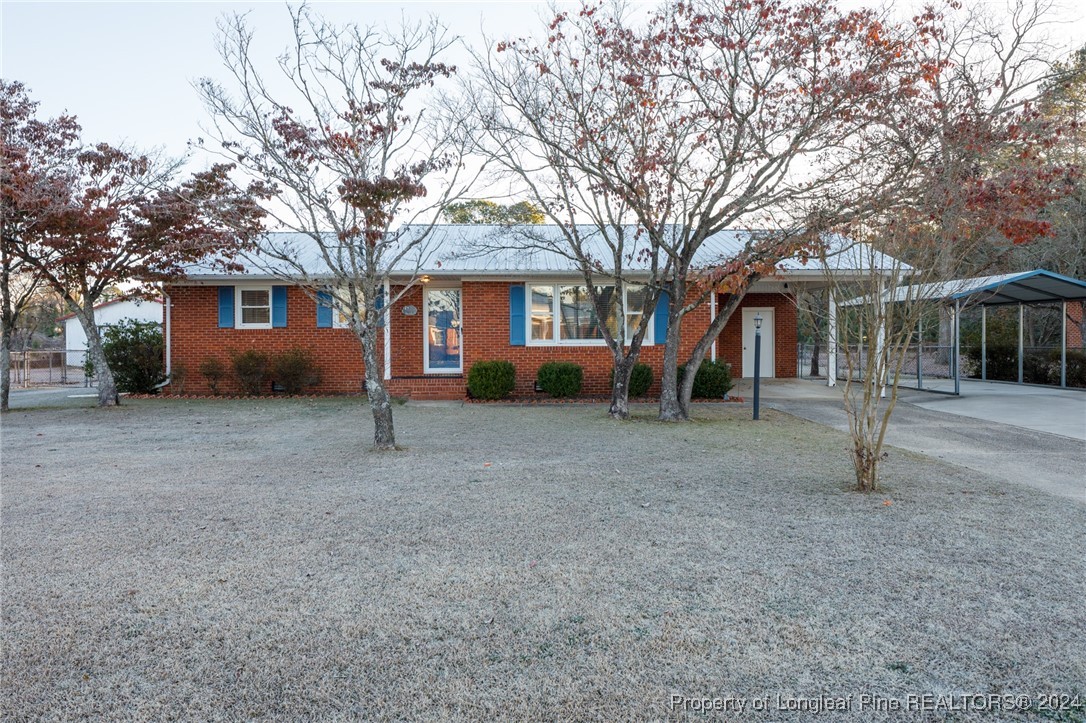 front view of a house with a yard