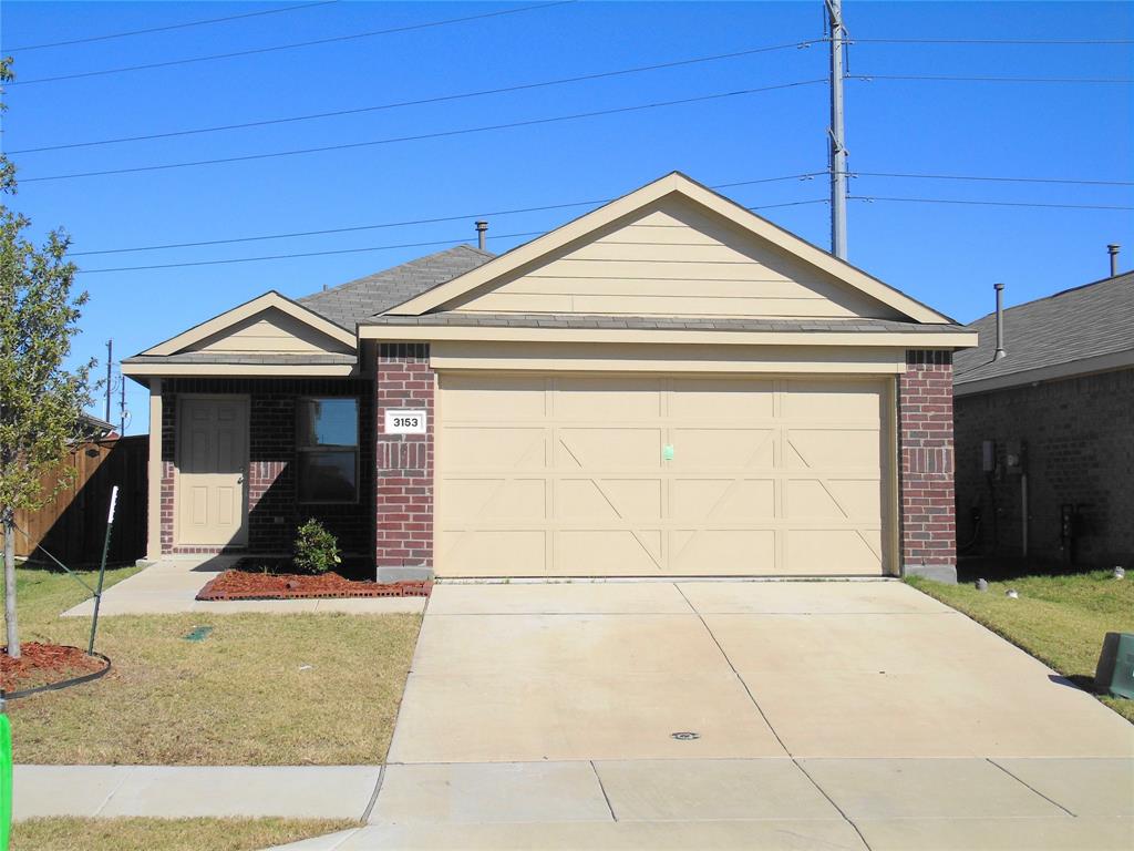 a front view of a house with garage