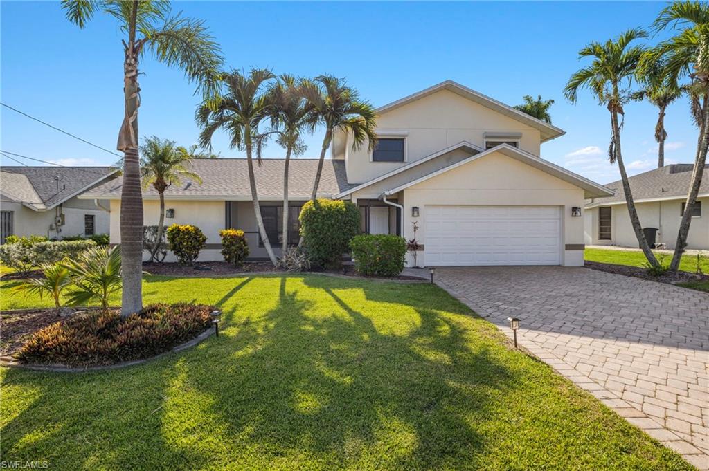 View of front of property with a front lawn