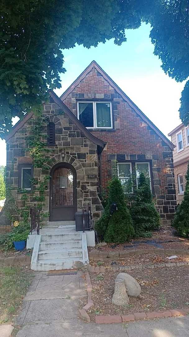 a front view of a house with yard