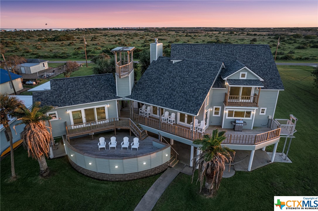 a aerial view of a house with a yard