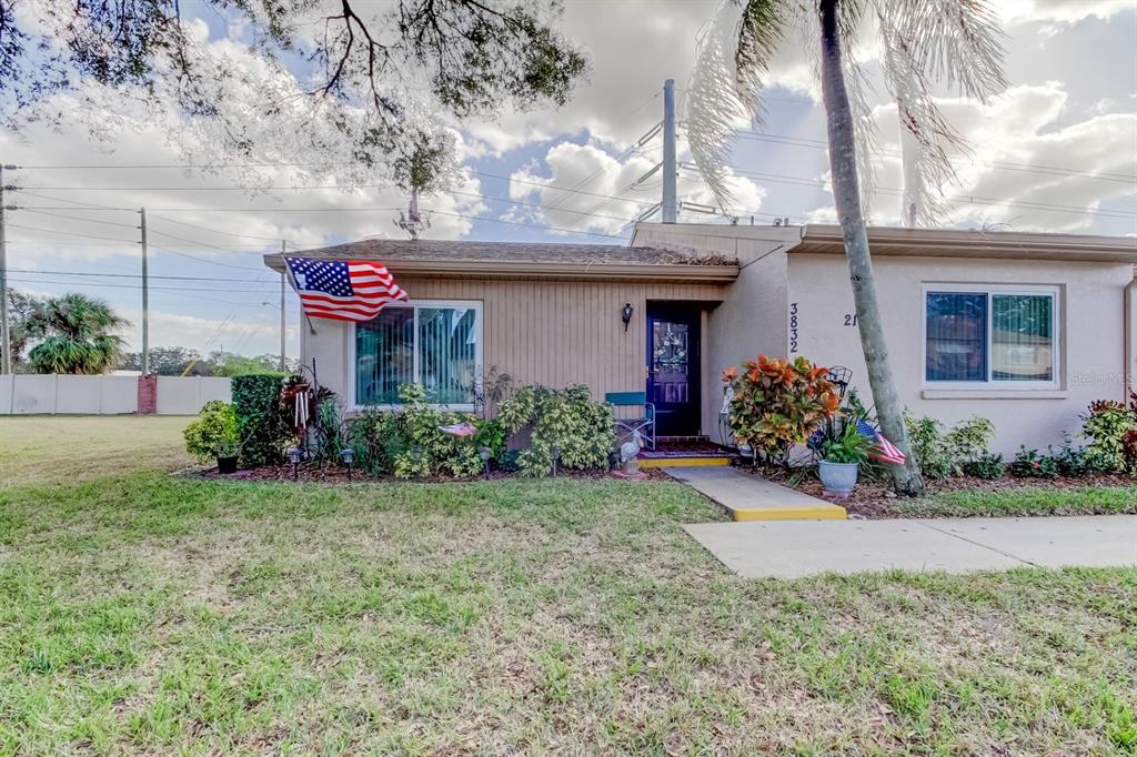 a front view of a house with a yard