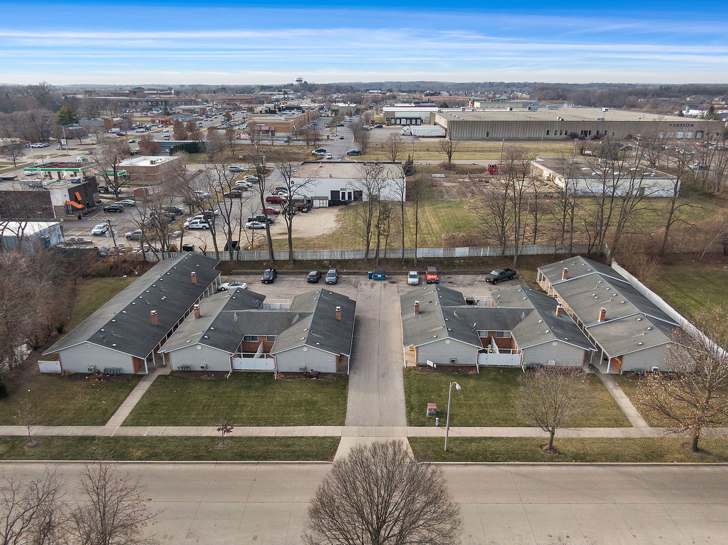 an aerial view of residential houses with outdoor space