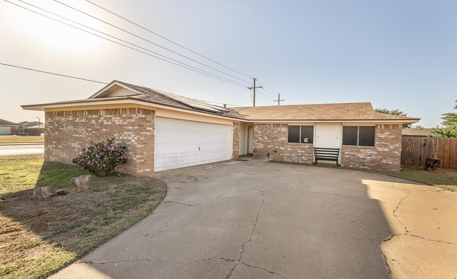 a front view of a house with a garage