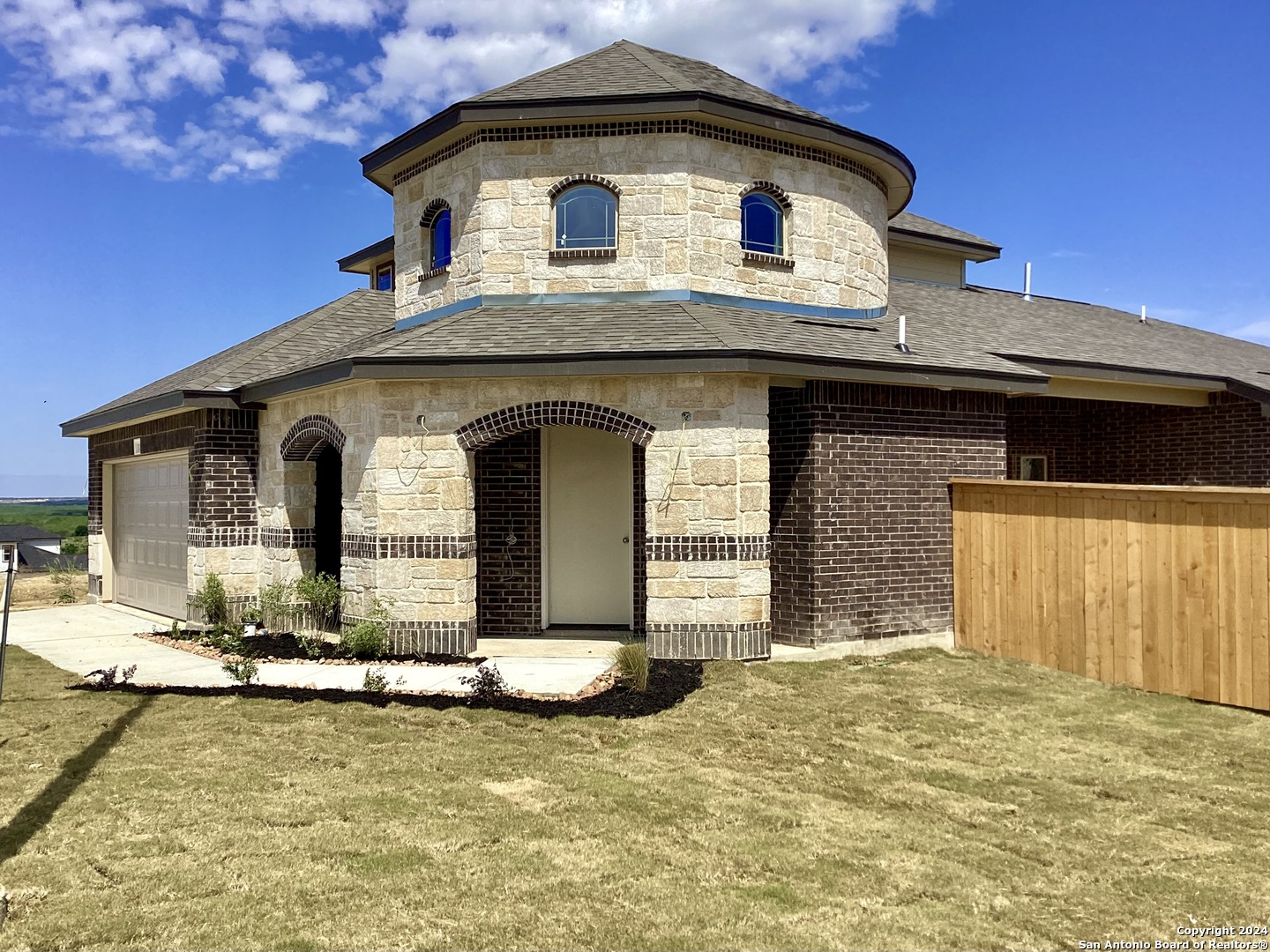 a front view of a house with a yard