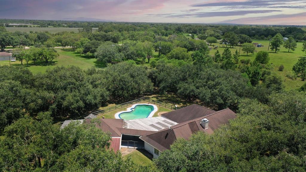 an aerial view of a house with a garden