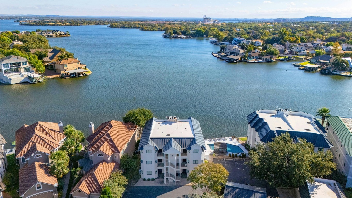 an aerial view of a house with a lake view