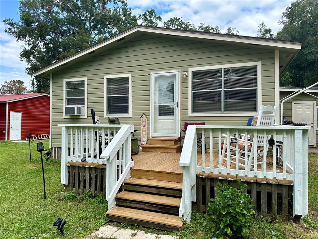 a front view of a house with a deck