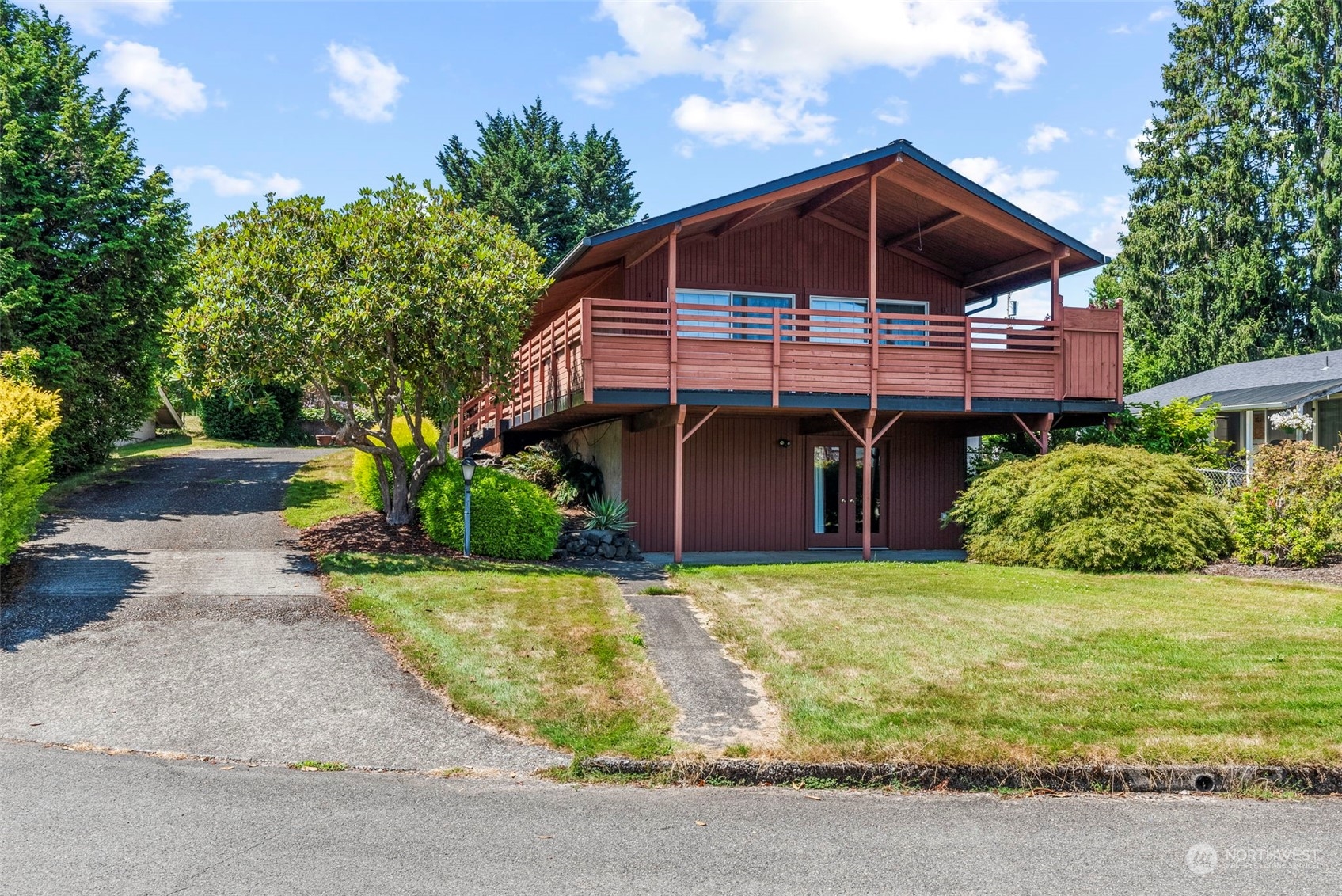 a front view of a house with garden